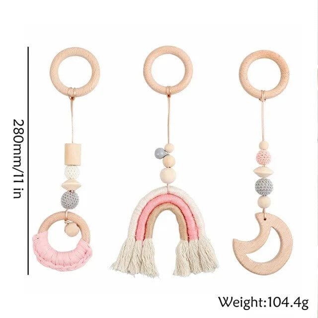 Three wooden baby teething toys with colorful beads and tassels on a white background.