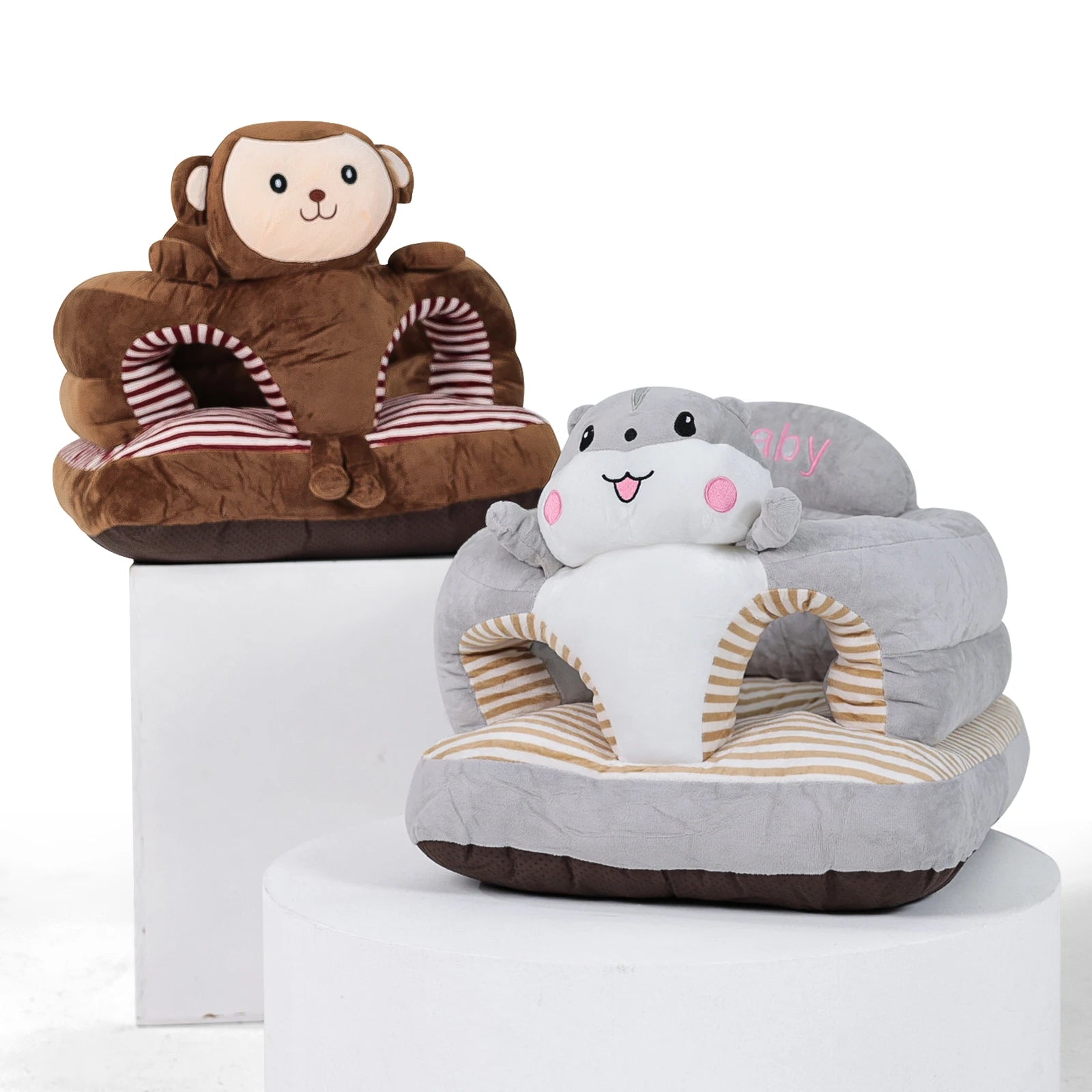 Baby infant training seat in shark and monkey plush designs for supported sitting practice at home.