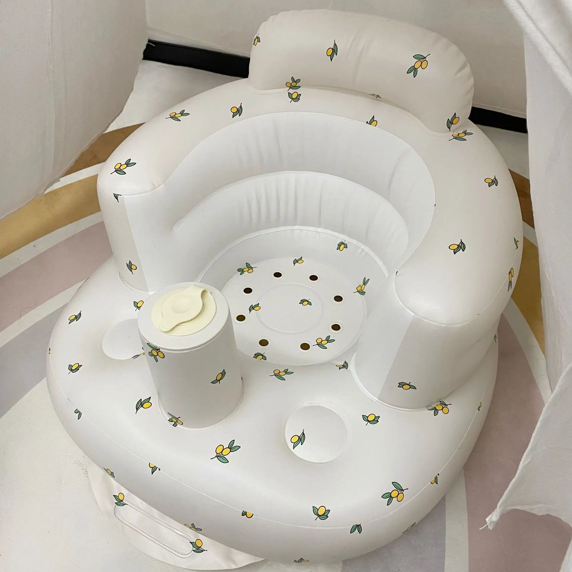Baby inflatable sofa with floral pattern for portable PVC floor seating and gentle nursery use.
