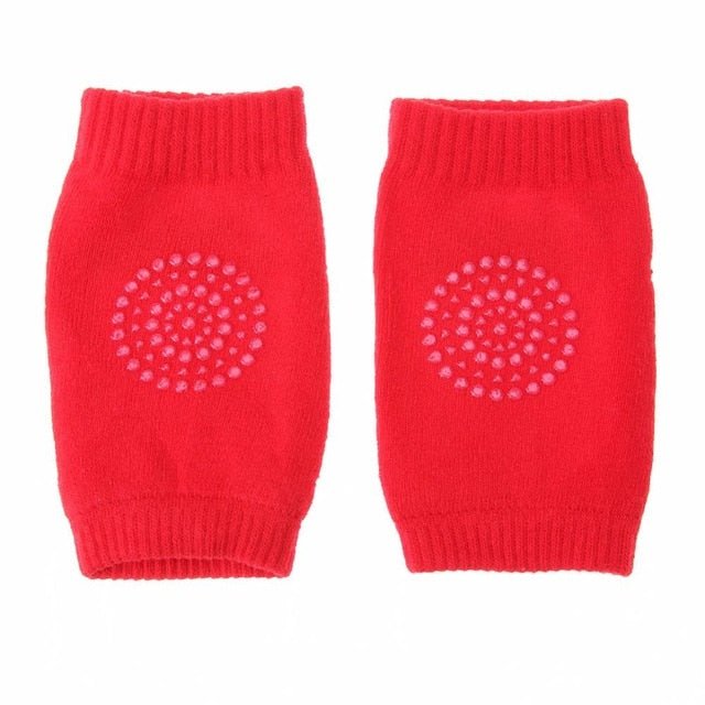 Pair of red knitted leg warmers with a pattern.