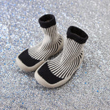 Pair of black and white striped socks 