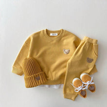 Yellow children's outfit with bear details