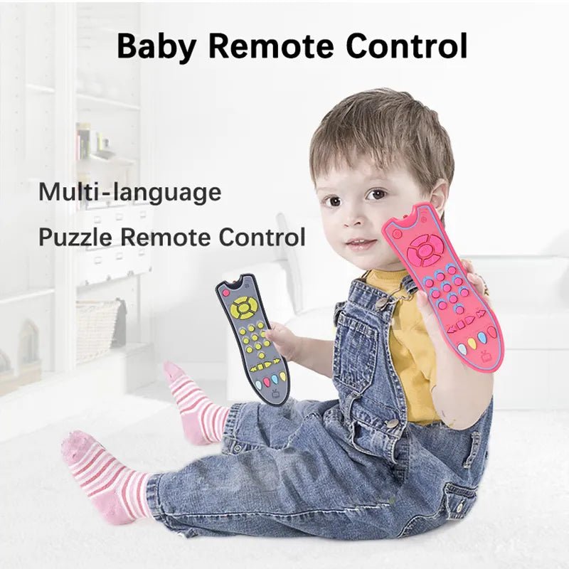 Baby multi-language remote control learning toy held by a child for early language pretend play.