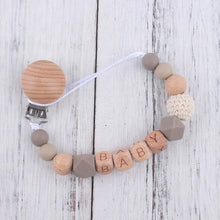 Close-up bead detail of the baby name pacifier clip and teether, made for gentle chewing during teething stages.