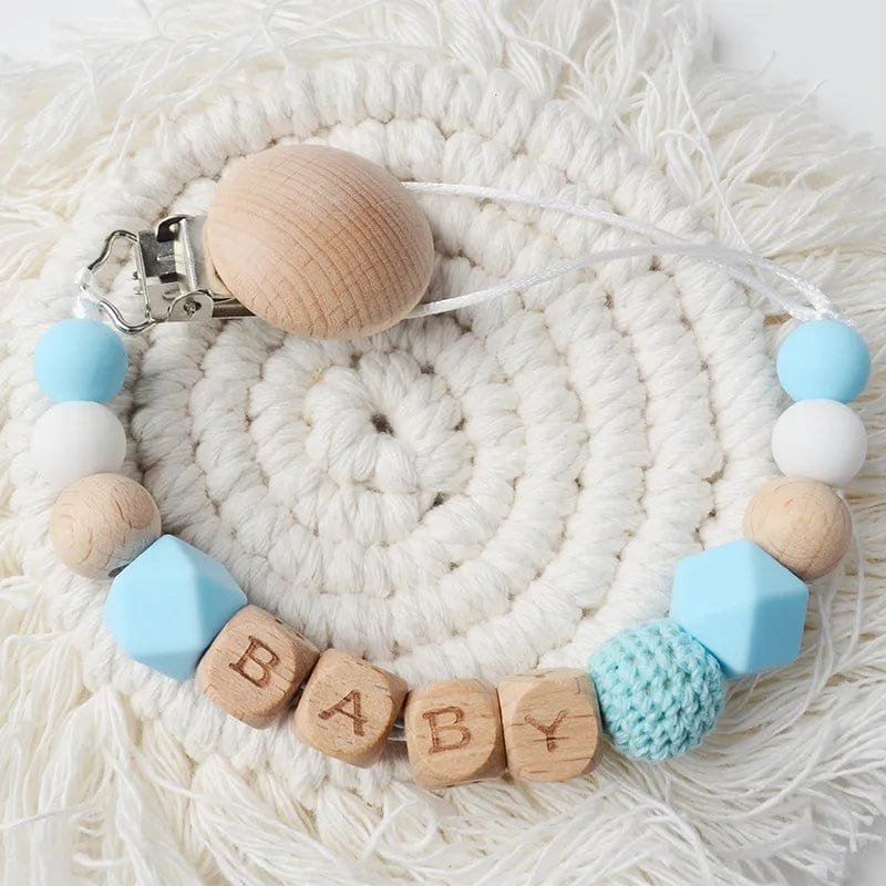 Design eleven of the baby name teether and pacifier chain, a gift idea for baby showers and newborn arrivals.