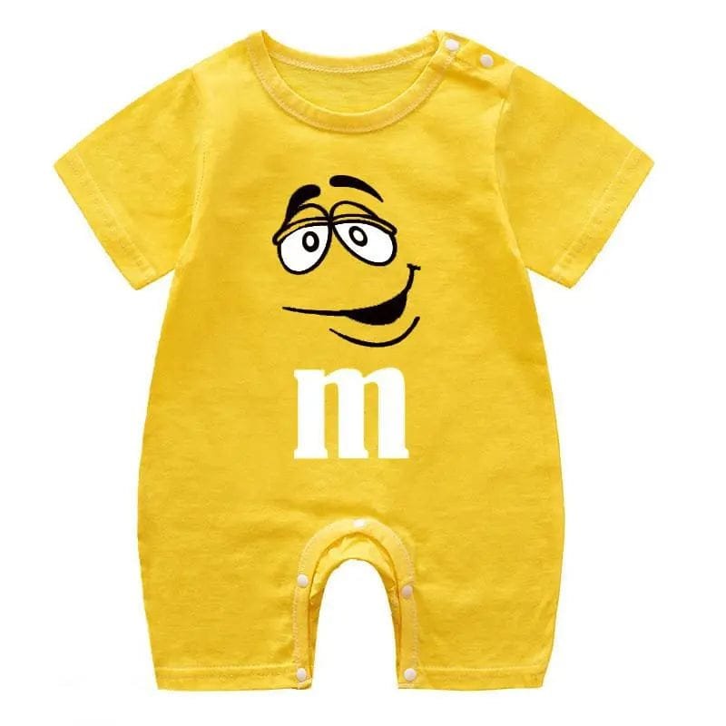 Yellow baby romper with a smiley face and 'm' logo