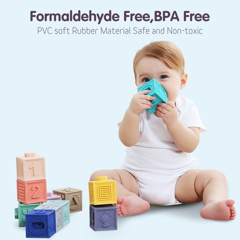 Baby playing with soft rubber grasp blocks for bath time fun and safe sensory exploration.