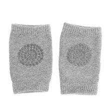 Grey knitted baby safety knee pads that are washable and reusable for everyday crawling and easy laundry care.