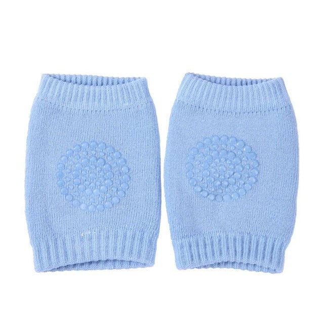 Light blue knitted baby knee pads for all-season comfort during indoor crawling and cooler weather play.