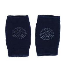 Navy baby crawling knee pads with secure grip pattern for confident movement on slippery floors.