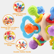 Colorful textured knobs, rattle rings and a teether handle on a baby sensory ball