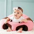 Baby Support Sofa Seat in pink and brown holding a baby upright for safe supported sitting practice at home.