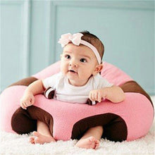 Baby Support Sofa Seat in pink and brown holding a baby upright for safe supported sitting practice at home.