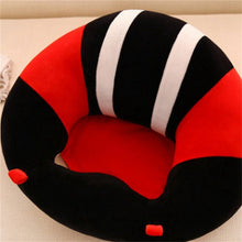Red, black, and white striped baby support seat for propped sitting practice on carpets and play mats.