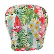 Flamingo and floral print baby swim diaper, a summer swim nappy for beach holidays and back garden paddling pools.