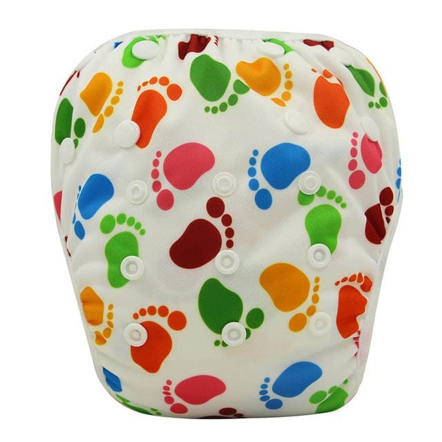 Colourful footprint print baby swim diaper, a reusable swim pant for babies learning to splash and paddle in the water.