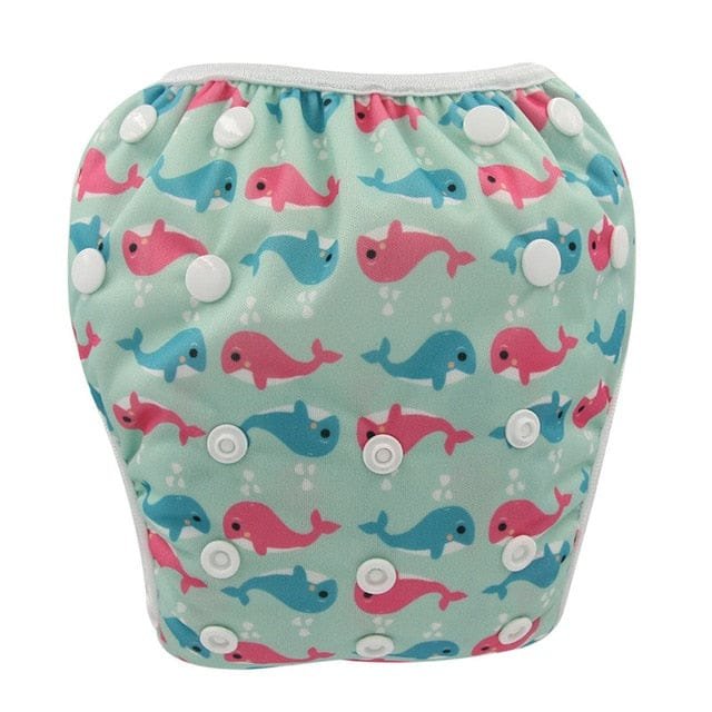 Whale print baby swim diaper, an adjustable reusable swim nappy that keeps pool and beach outings mess free.