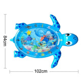 Blue turtle-shaped inflatable play mat with ocean-themed graphics and measurements.