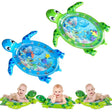Two inflatable turtle-shaped water play mats with baby illustrations.