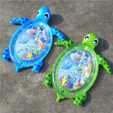 Two inflatable turtle toys with water play areas on a concrete surface.