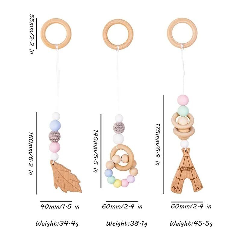 Wooden baby teether with measurements and weight details on a white background