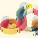 Colorful toy track with a small yellow duck-like figure.