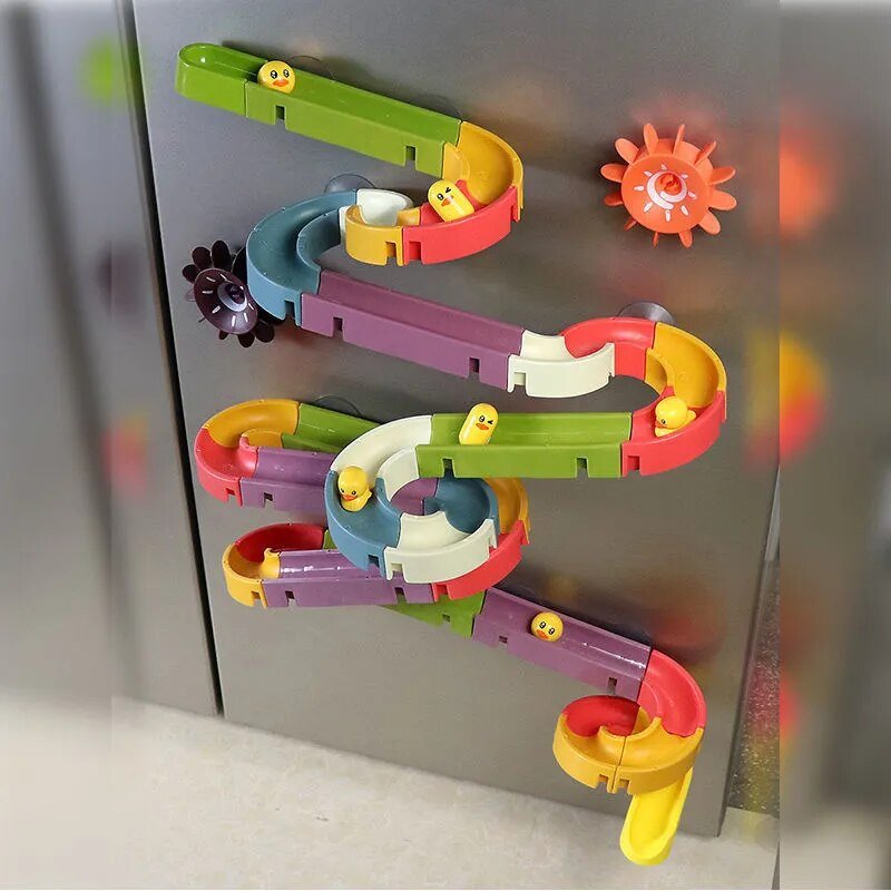 Colorful magnetic marble run toy on a metallic surface