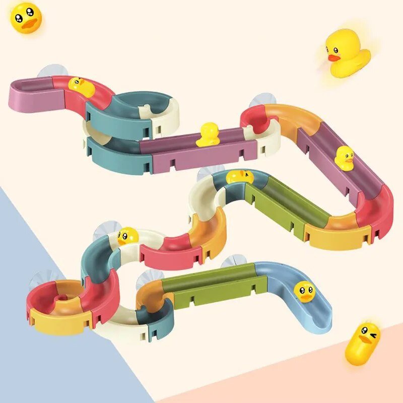 Colorful toy track set with small rubber ducks.