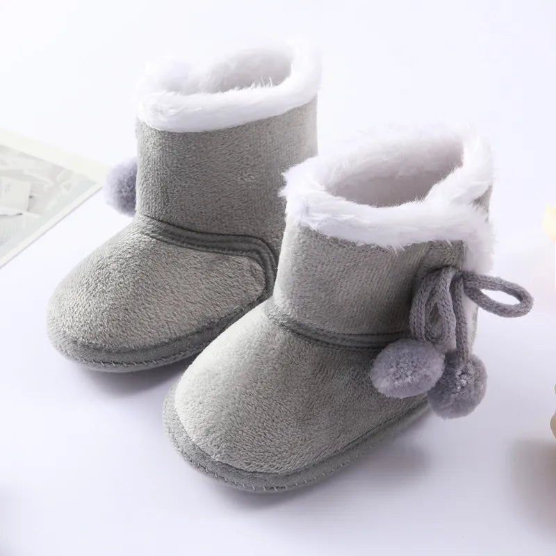 Baywell pink autumn winter newborn boots with soft sole and fur lining, arranged as a matching pair in a flat lay for cozy baby wear from 0 to 18 months.