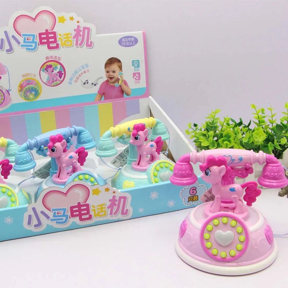 Children's toy phone with pink pony design in front of its packaging on a white background