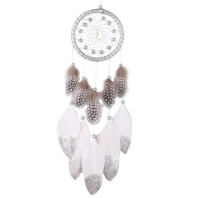 Beaded feather dream catcher crafted as decorative wall art for boho-style rooms.