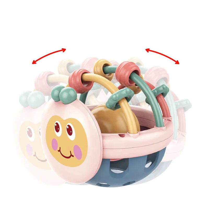 Pastel white bee rattle ball with bead rings shown in a shaking motion
