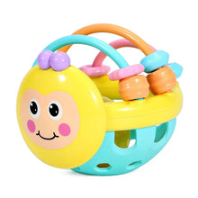 Yellow bee-face rattle ball with colorful bead rings and a teal base with round holes