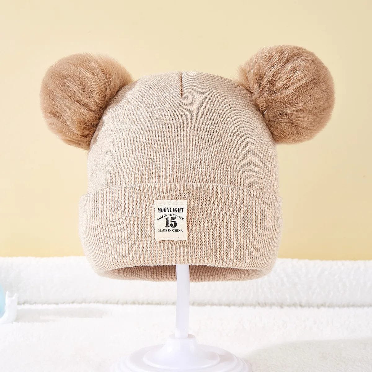 Beige Warm Knitted Baby Beanie in a neutral tone for autumn and winter layering during walks and errands.