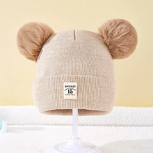 Beige Warm Knitted Baby Beanie in a neutral tone for autumn and winter layering during walks and errands.
