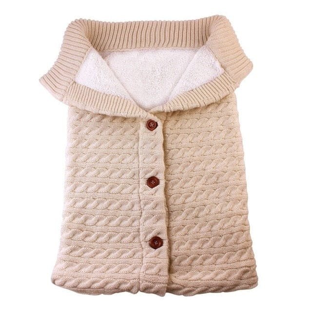 Beige newborn sleeping bag with adjustable button fit that grows with baby through the first months.