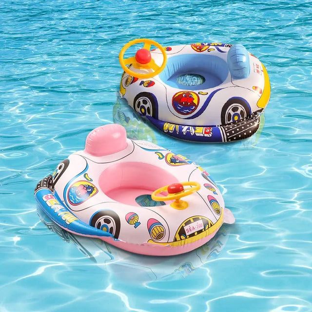 Two inflatable car-shaped swim rings in pink and white with colorful designs on a blue water background.