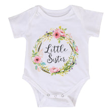 White baby onesie with floral design and 'Little Sister' text