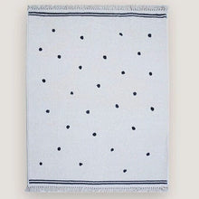 Textile with black dot pattern.