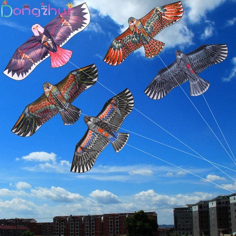 Five colorful eagle-shaped kites flying against a blue sky.