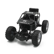 Black 4WD RC off-road truck side view designed for high-speed radio control driving.