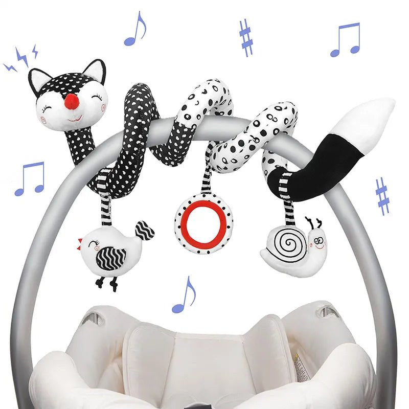 Baby crib mobile with cat-themed hanging toys.
