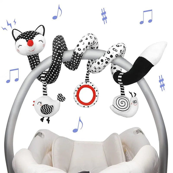 Baby crib mobile with cat-themed hanging toys.