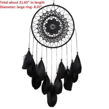 Black feather rattan dream catcher in a vintage-inspired design for statement wall decor.