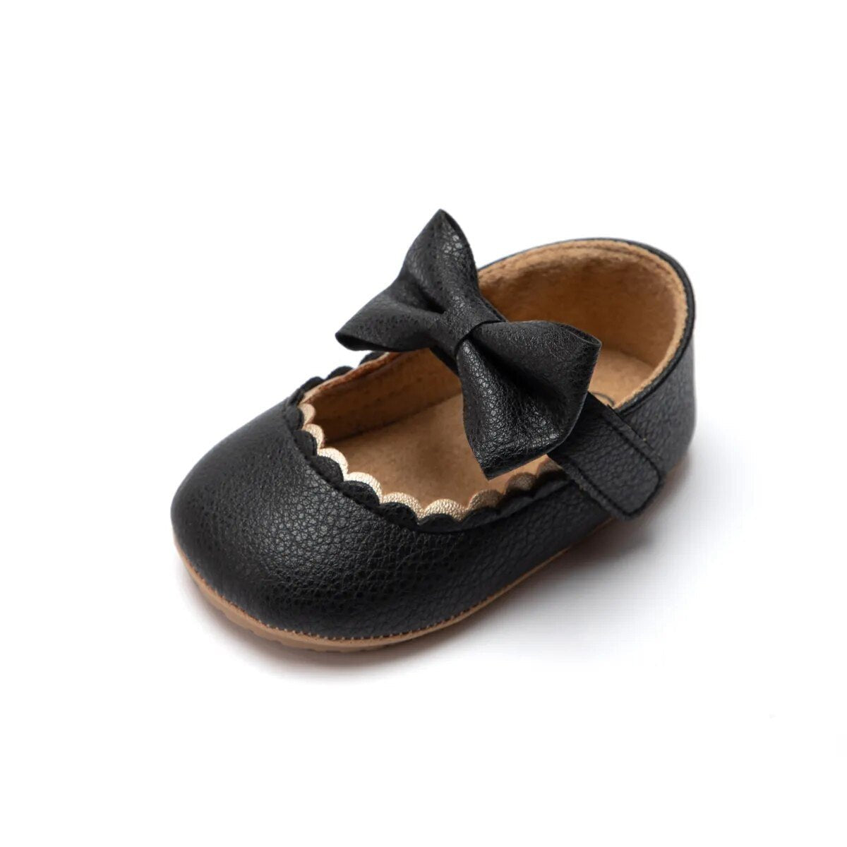 Black leather baby bowknot Mary Jane first-walker shoes with non-slip sole for early steps.