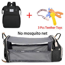 Mommy diaper bag with travel crib bed in black, packed with teether toys and mosquito net.