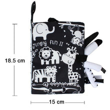 Black and white jungle animal cloth book with measurements for newborn visual stimulation.