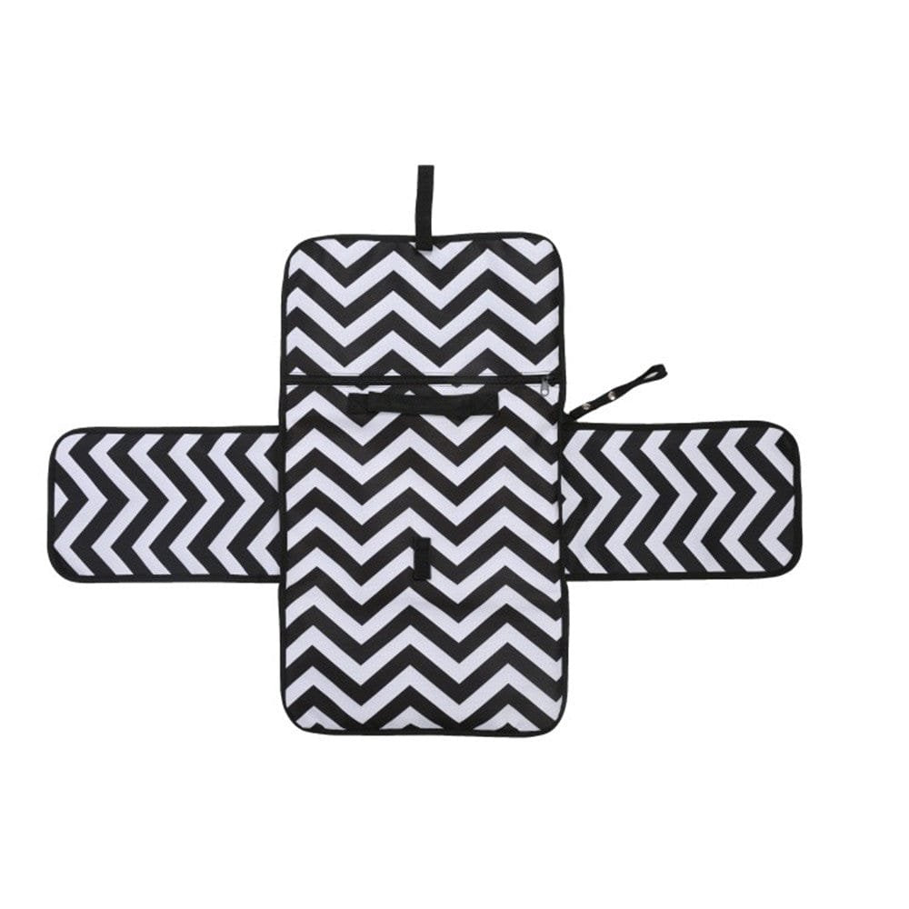 Black and white zigzag baby changing pad with a wipe clean surface for mess-free nappy changes anywhere.