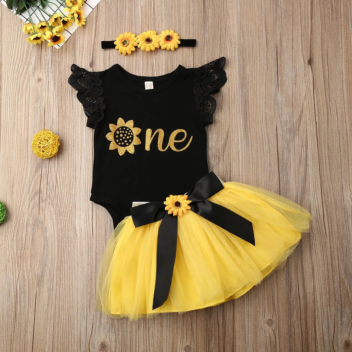 Black and yellow sunflower tutu skirt romper set for newborn girls daily wear and special occasion dressing.