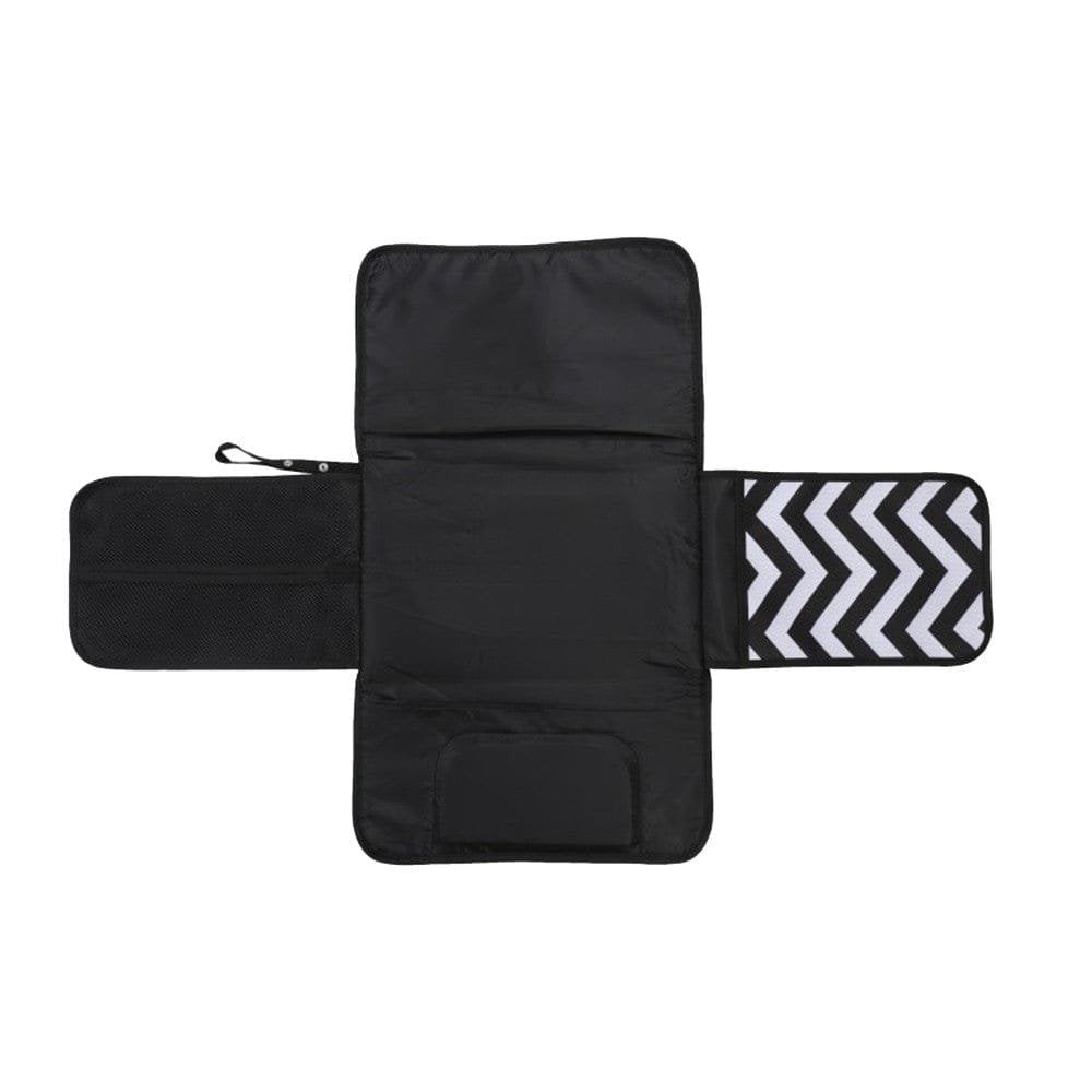 Black zigzag waterproof baby diaper changing pad unfolded for hygienic nappy changes on any surface.